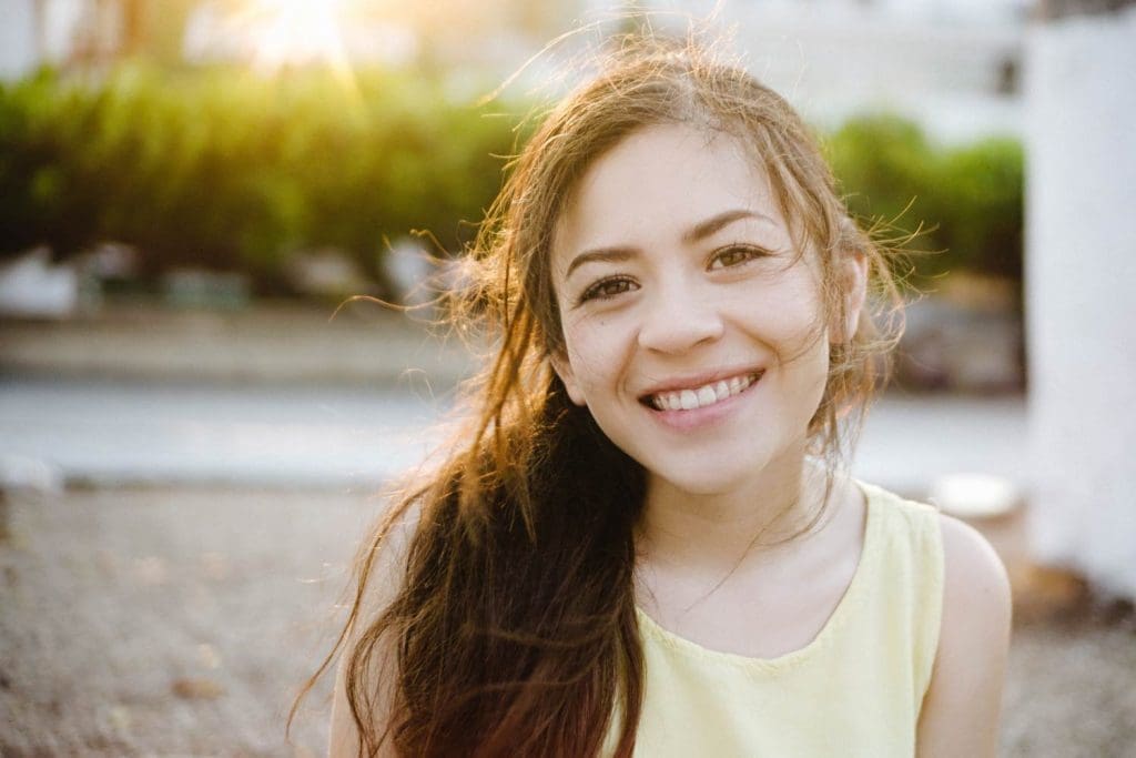 A woman smiling at the camera.