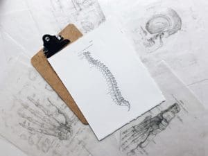 A drawing of a skeleton on a clipboard, focusing on knee pain management.