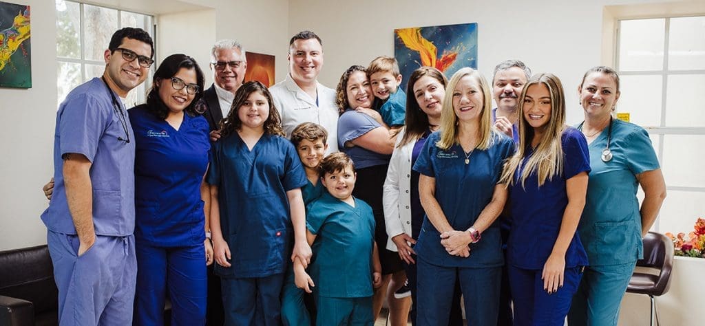 family spine care staff group photo