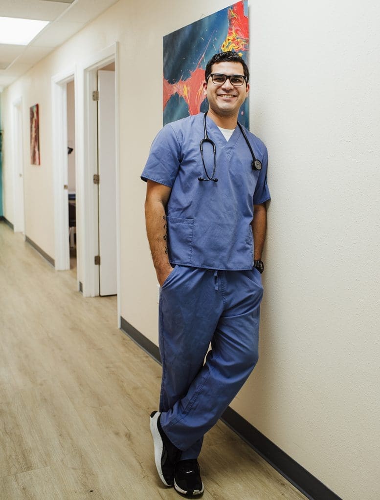employee-in-hallway Knee Pain Symptoms, Causes & Treatment