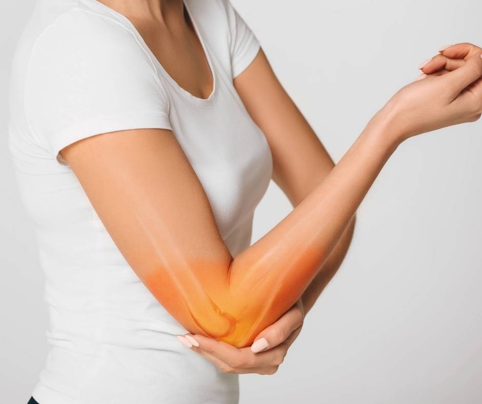 A woman with a pain in her elbow.